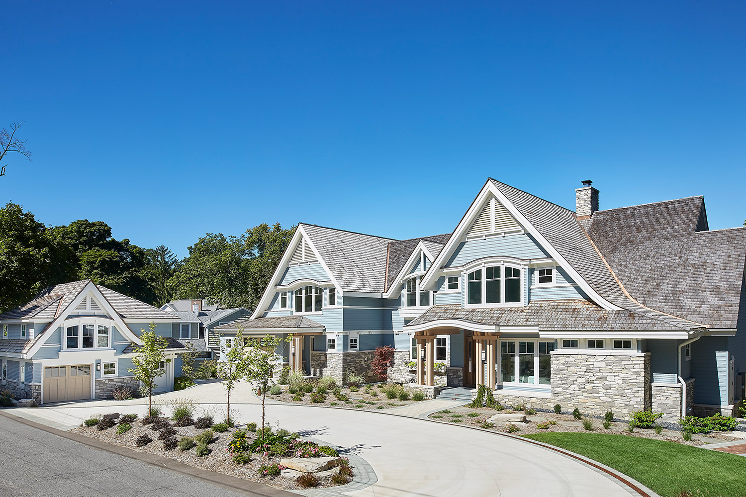 Custom Michigan home with natural stone veneer exterior by The Stone Mill